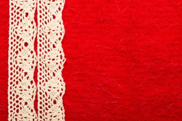 Lace over red background — Stock Photo, Image