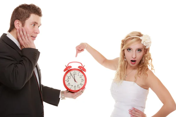 Bride and groom with clock. — Stock Photo, Image