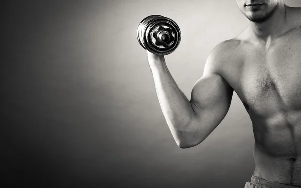 Man working with heavy dumbbells — Stock Photo, Image