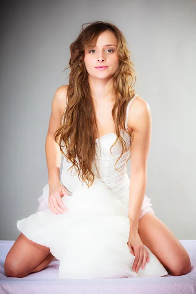 Woman with pillow posing — Stock Photo, Image