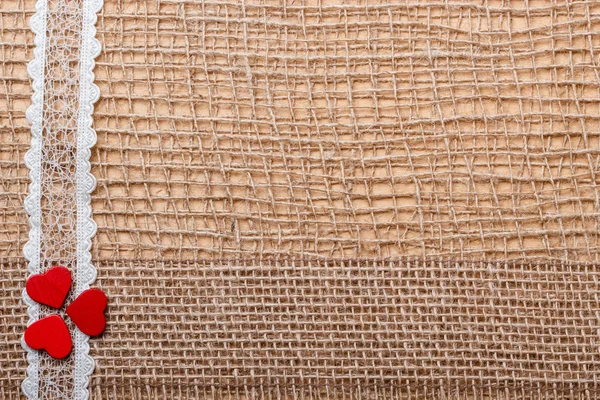 Red hearts on  cloth — Stock Photo, Image