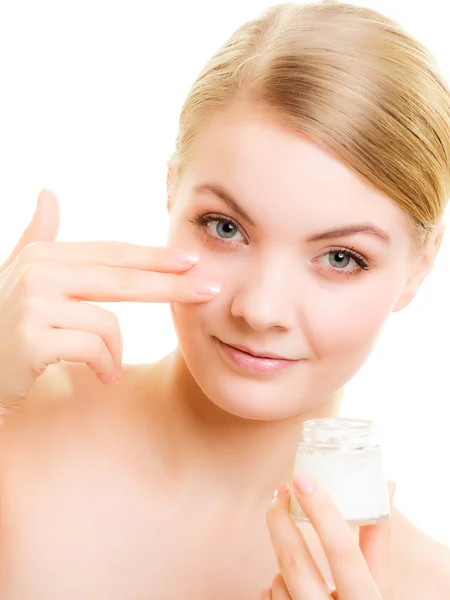 Girl applying moisturizing cream — Stock Photo, Image