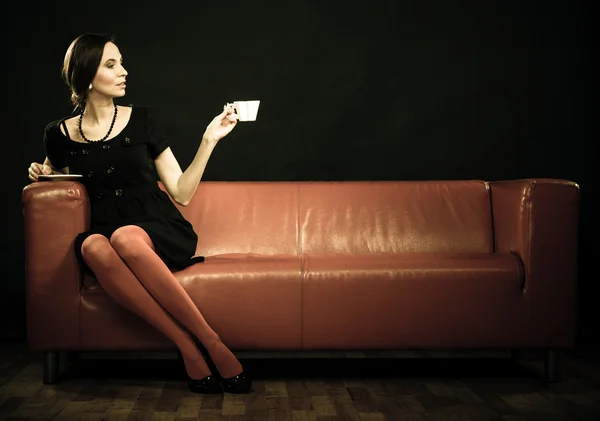 Woman holding tea cup — Stock Photo, Image