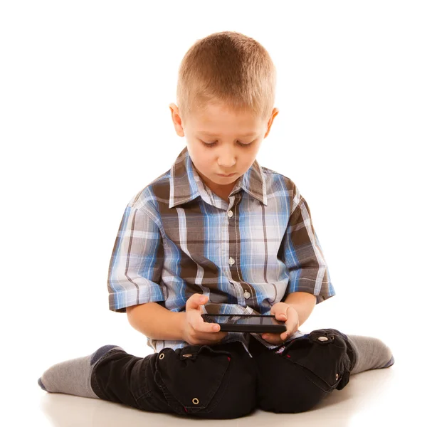 Little boy playing on smartphone — Stock Photo, Image