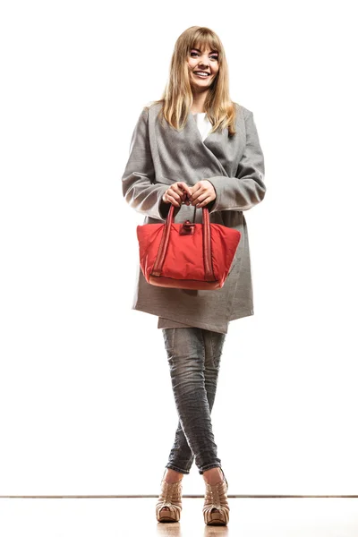 Woman in coat holding handbag — Stock Photo, Image