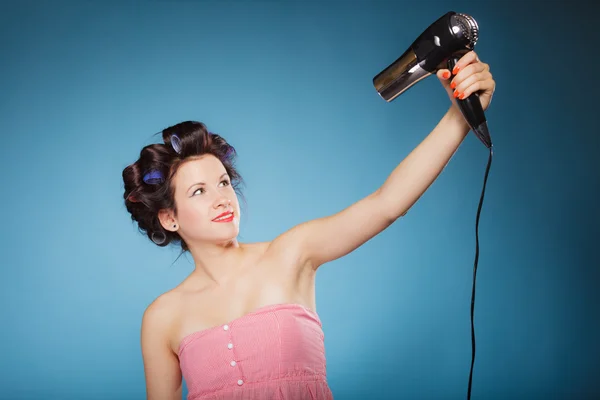 Girl holding hairdreyer Stock Photo