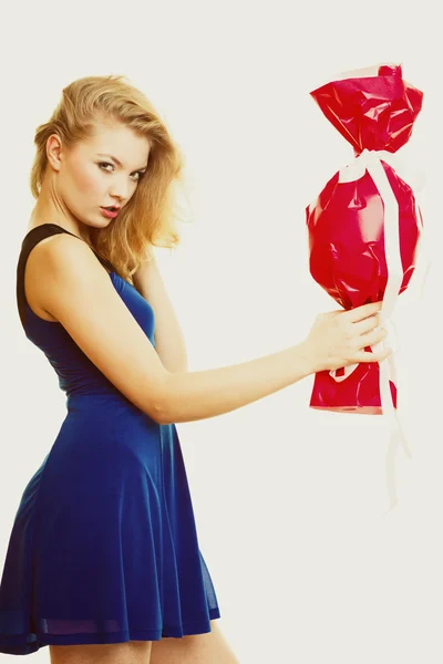 Girl holding red gift — Stock Photo, Image