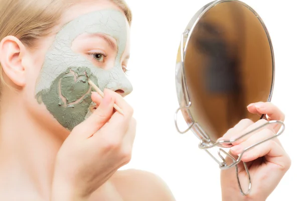 Woman looking in the mirror — Stock Photo, Image