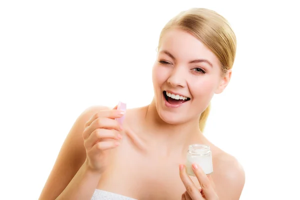 Girl applying moisturizing cream. — Stock Photo, Image