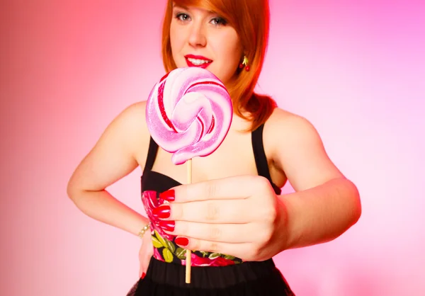 Woman holding lollipop in hand. — Stock Photo, Image