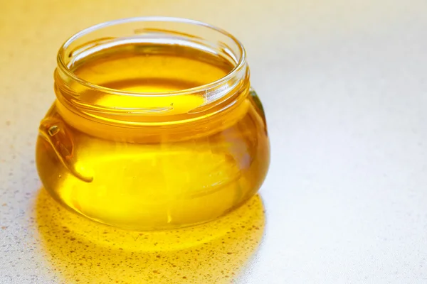Jar of organic floral honey — Stock Photo, Image