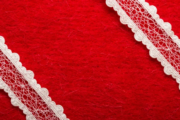 White lace over red background — Stock Photo, Image