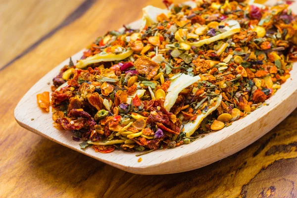 Colored spices for pasta mix on wooden spoon — Stock Photo, Image