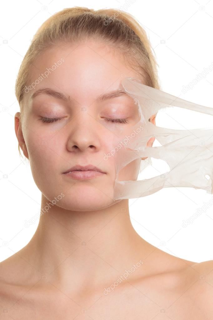 Girl removing mask — Stock Photo © Voyagerix 68882767