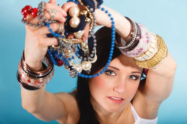 Girl holding jewellery — Stock Photo, Image