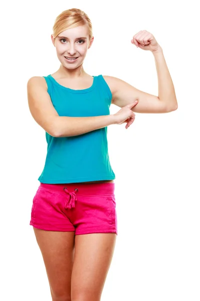 Young woman showing her muscles — Stock Photo, Image