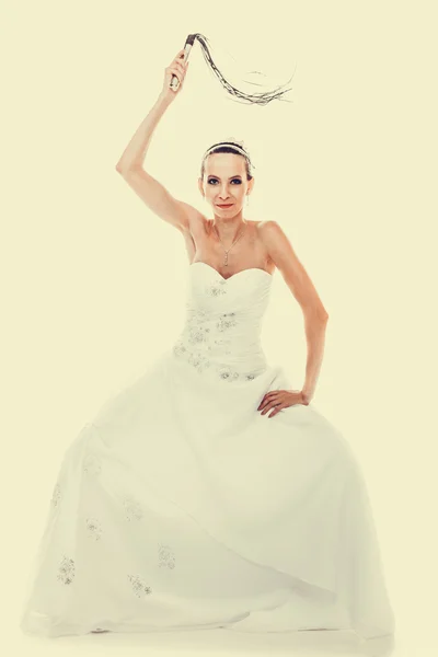 Bride holding black whip — Stock Photo, Image