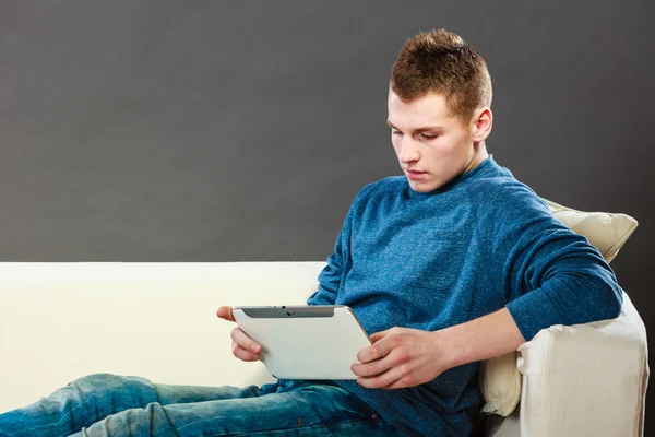 Young man using tablet