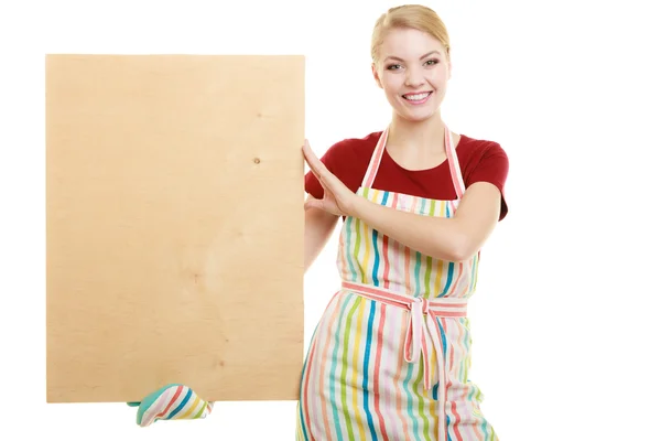 Housewife holding wooden board — Stock Photo, Image