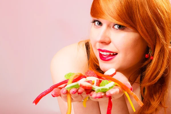 Woman holding candies — Stock Photo, Image