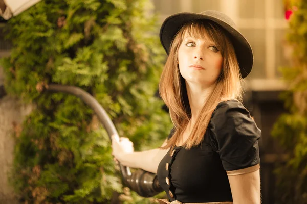 Retro style fashion woman in old town — Stock Photo, Image