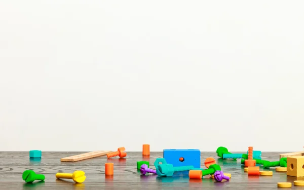 Multicolored toy blocks on wooden table — Stock Photo, Image