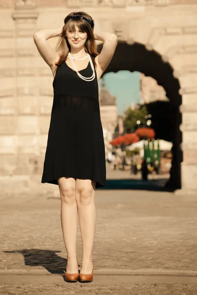 Girl  in black dress posing — Stock Photo, Image