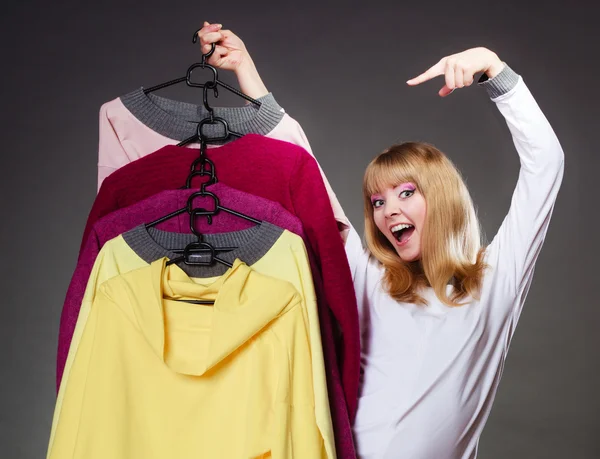 Woman holding hangers — Stock Photo, Image