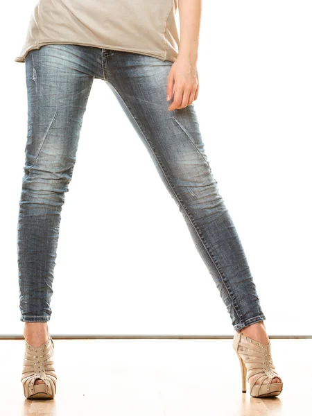 Woman legs in denim trousers — Stock Photo, Image