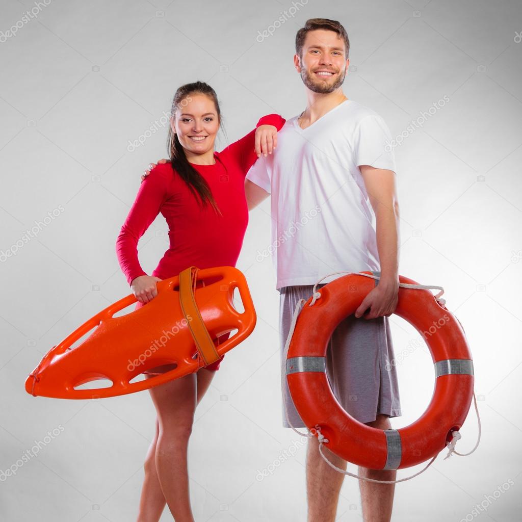 Lifeguards on duty with equipment — Stock Photo © Voyagerix 72476323