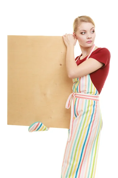 Housewife holding wooden board — Stock Photo, Image