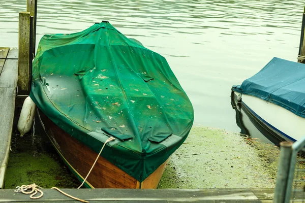 Fishing boat rowboat moored and floating at coast. — Stock Photo, Image