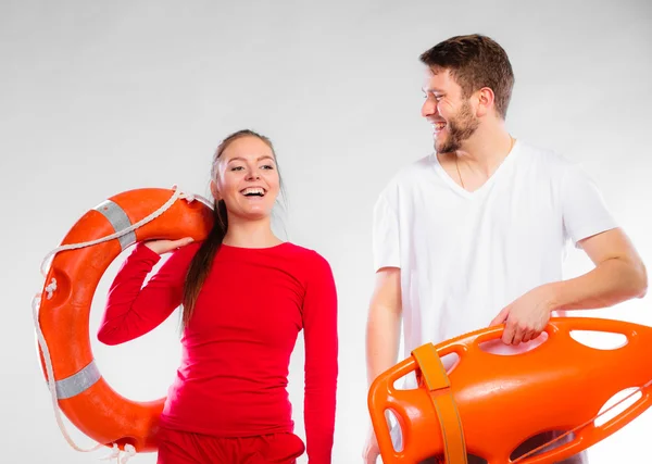 Lifeguard couple with rescue equipment — Stock Photo, Image