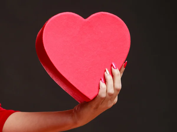 Woman holding heart shaped box — Stock Photo, Image