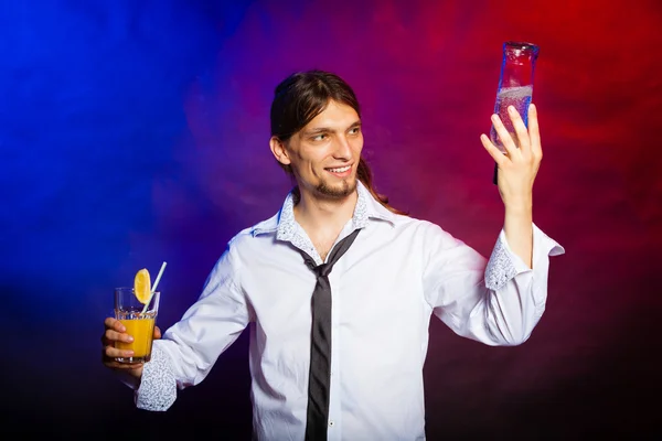 Young man pouring a drink — Stock Photo, Image