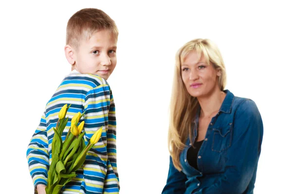 Child  giving flowers to his mother — Stock Photo, Image