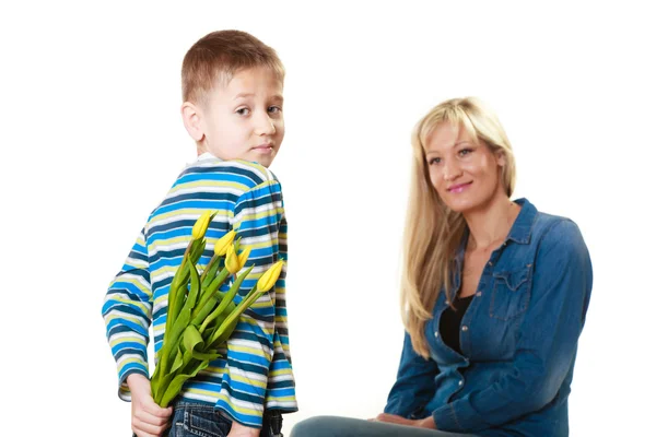 Child  giving flowers to his mother — Stock Photo, Image