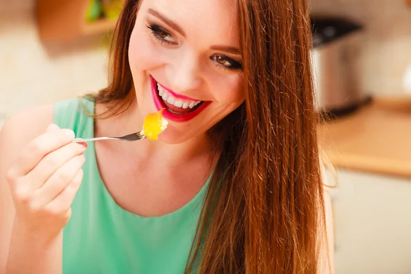 Woman eating cream cake Royalty Free Stock Images