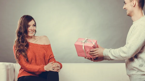 Man surprising cheerful woman — Stock Photo, Image