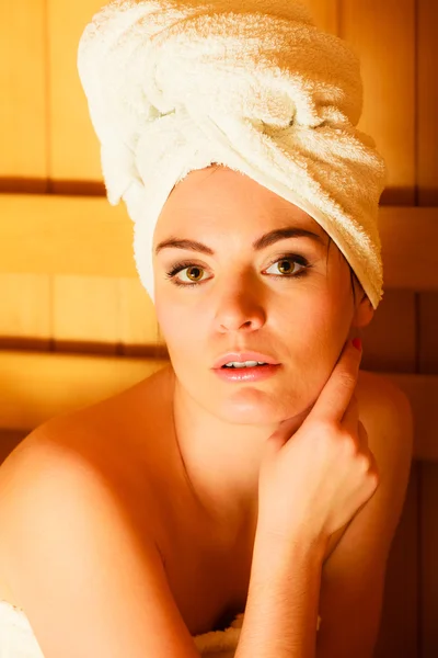 Woman relaxing in wooden sauna Royalty Free Stock Photos