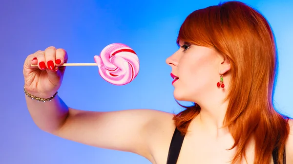 Woman with sweet candy lollipop in hand. — Stock Photo, Image