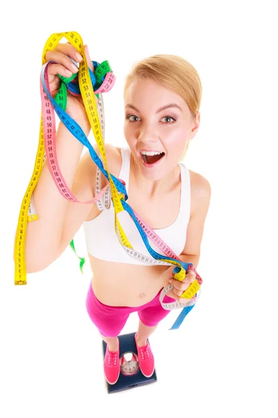 Joyful woman on weighing scale. Slimming diet. — Stock Photo, Image