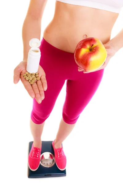 Vrouw met vitaminen en appel. Gezondheidszorg. — Stockfoto