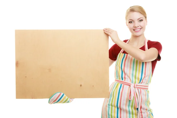 Housewife holds wooden board with copy space — Stock Photo, Image