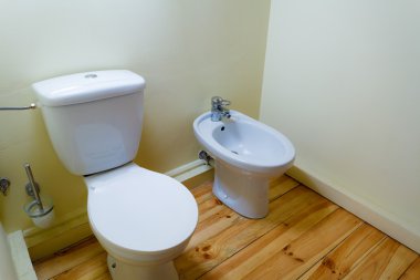 white porcelain bidet and toilet wc. clipart