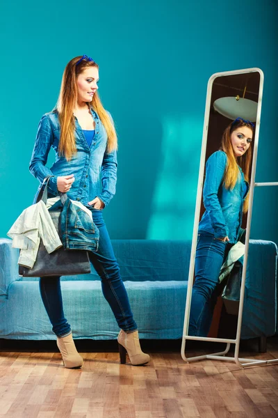 Fashion woman wearing blue denim in front of mirror — Stock Photo, Image