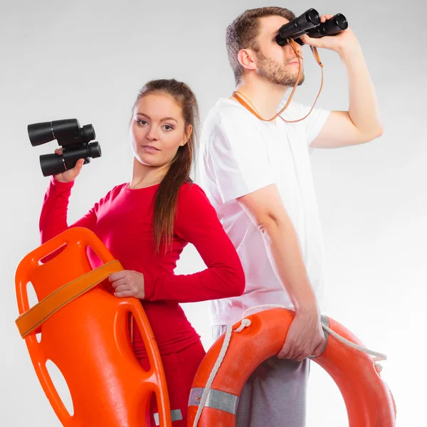 Lifeguards on duty looking through binoculars — Stock Photo, Image