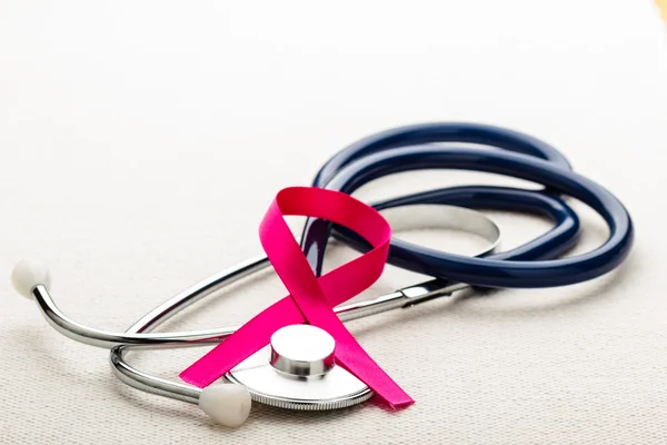 Pink ribbon on stethoscope. — Stock Photo, Image