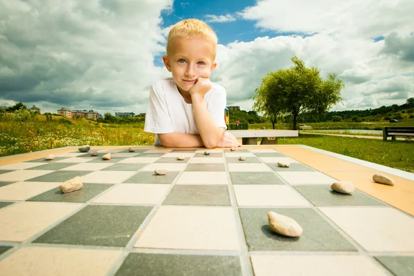 Child playing checkers