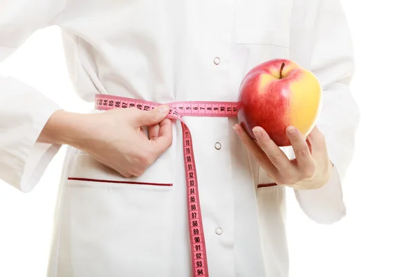 Doctor sosteniendo manzana —  Fotos de Stock